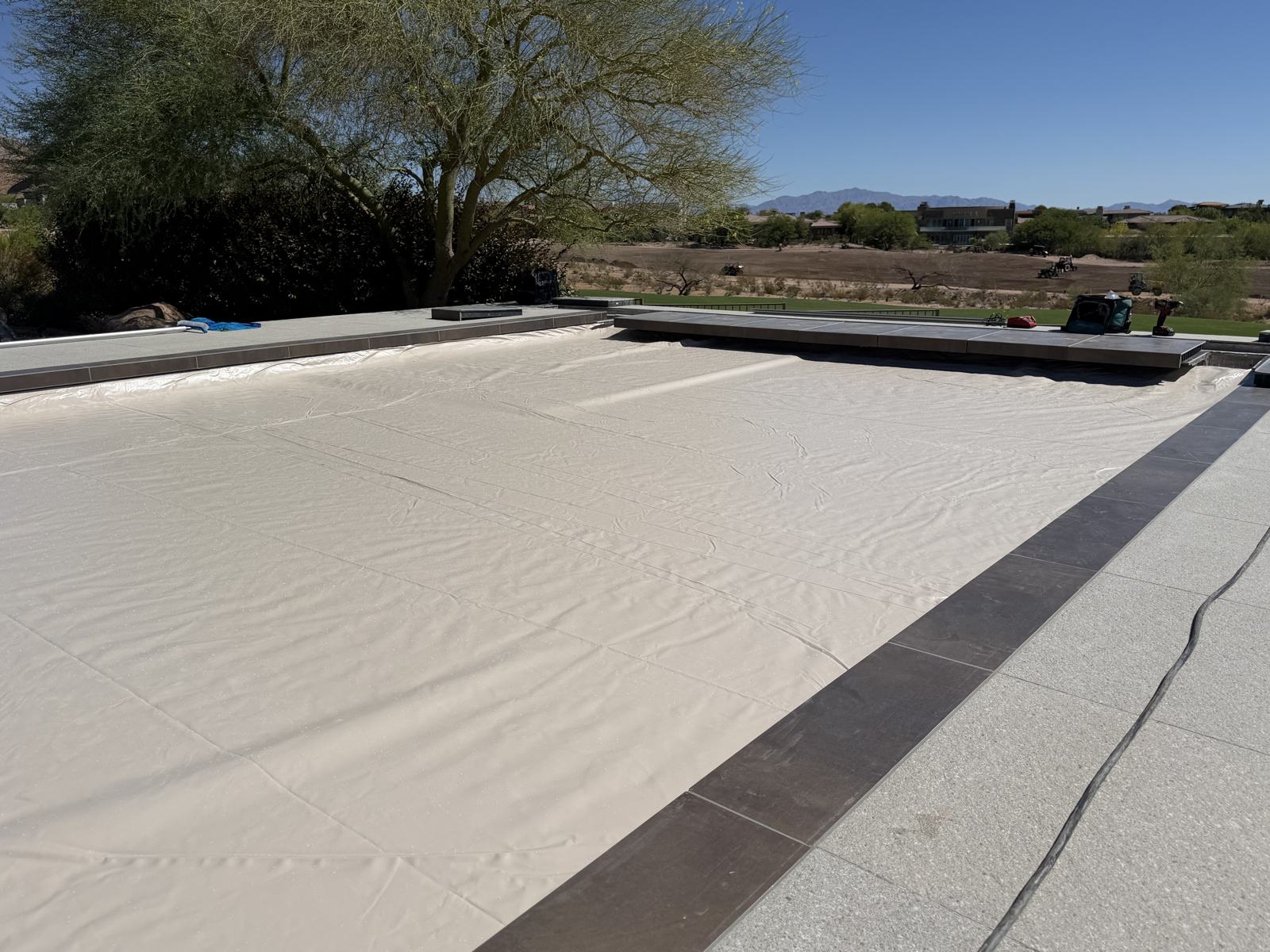 Automatic safety cover fully closed over a new pool