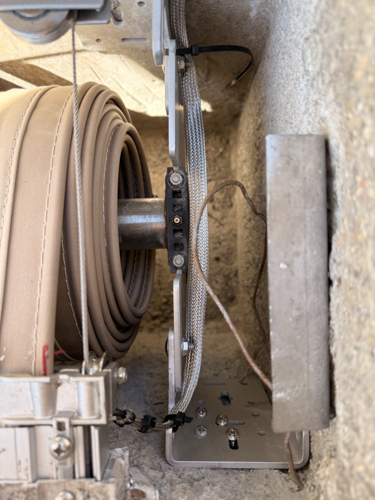 Close-up of a pool cover reel and mechanism during service